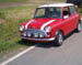 Red Mini Cooper with white stripes